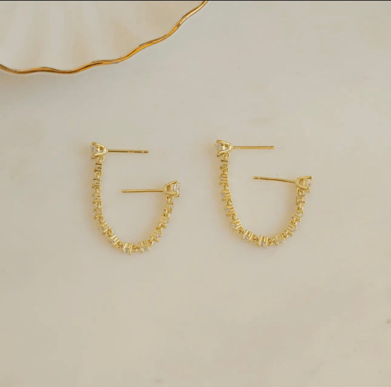 Two piercing chain studs